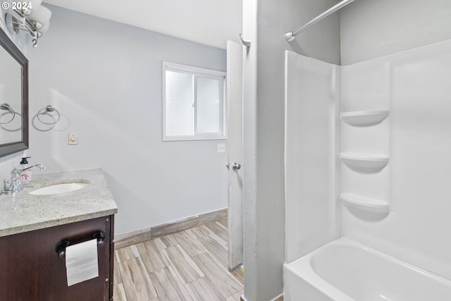 bathroom with vanity and bathtub / shower combination