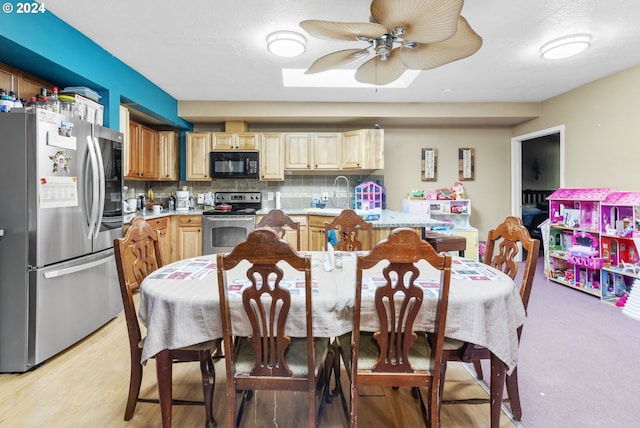 dining space featuring ceiling fan