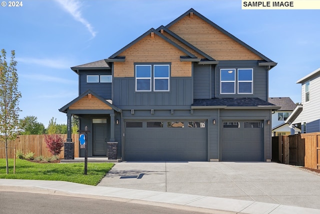 craftsman house featuring a front lawn and a garage