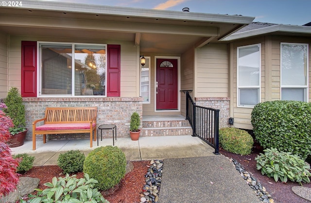 view of exterior entry featuring a porch