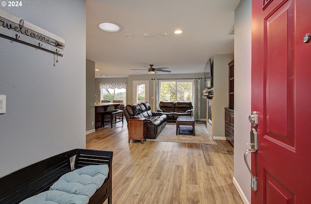 entrance foyer with light hardwood / wood-style floors and ceiling fan