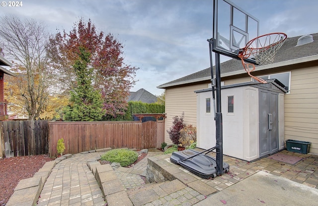 view of patio with a storage unit