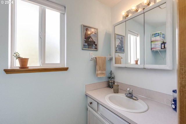 bathroom featuring vanity and a healthy amount of sunlight