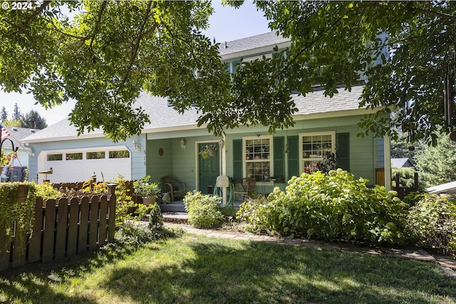 view of front facade featuring a garage and a front lawn