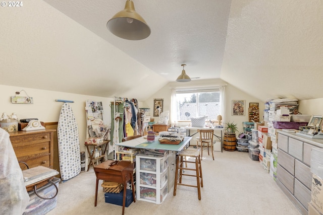 interior space with vaulted ceiling and a textured ceiling