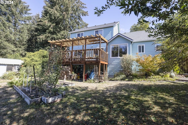 rear view of property with a lawn and a deck