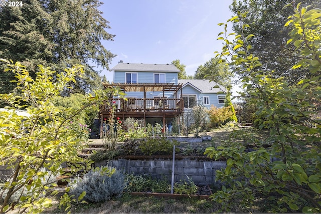 back of house with a wooden deck