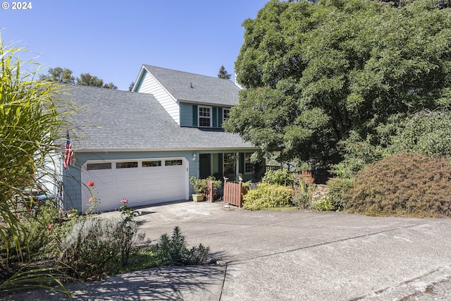 view of front of home with covered porch and a garage