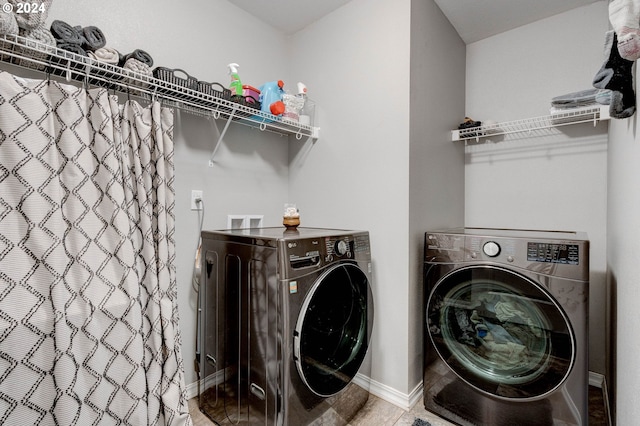 clothes washing area with washer and dryer