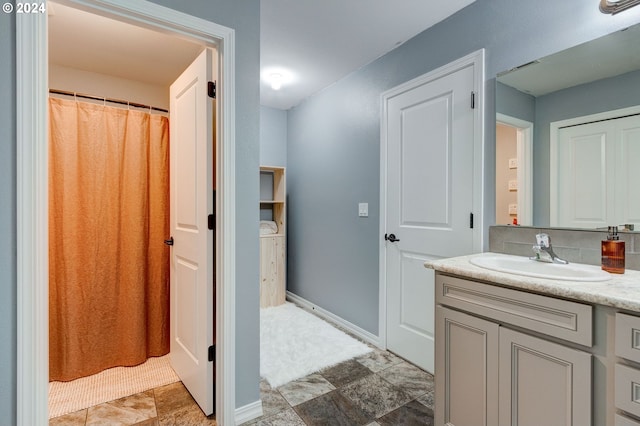 bathroom with tile patterned flooring and vanity