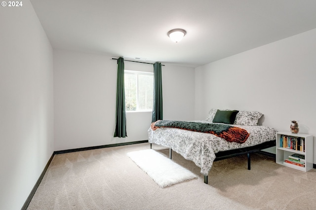 bedroom with light colored carpet