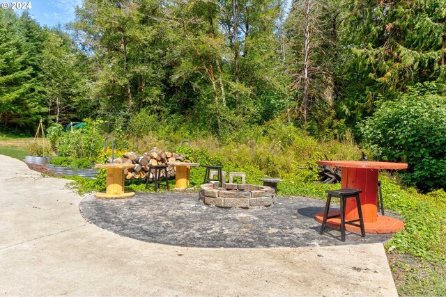 view of patio / terrace with a fire pit