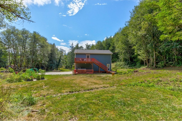 view of yard with a wooden deck