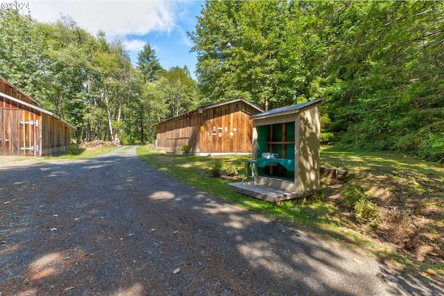 view of road with an outbuilding