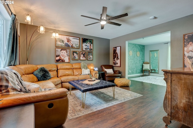 living room featuring ceiling fan and hardwood / wood-style flooring