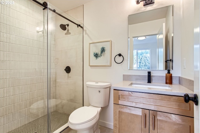 bathroom with vanity, toilet, and walk in shower