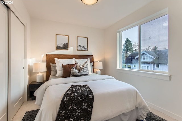 carpeted bedroom with multiple windows