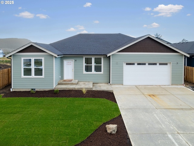 ranch-style home featuring a garage and a front yard