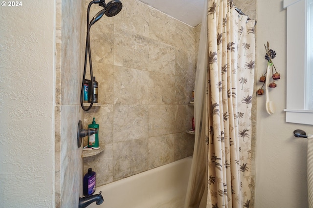 bathroom with shower / bathtub combination with curtain