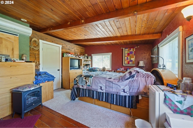 bedroom featuring a wood stove, wood ceiling, dark wood-type flooring, and beamed ceiling