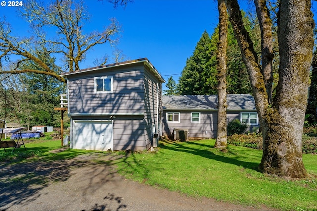 view of front facade with a front lawn and a garage