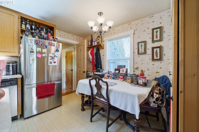 dining space featuring a notable chandelier