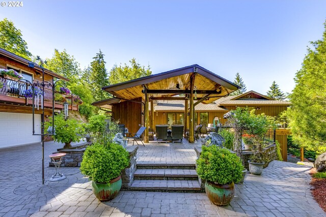 view of patio / terrace featuring a garage