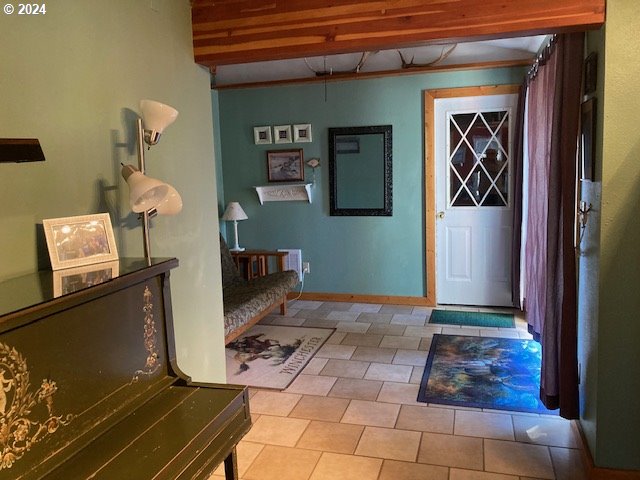 foyer entrance featuring light tile patterned floors