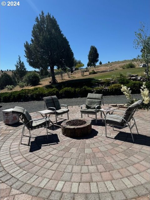 view of patio with a fire pit