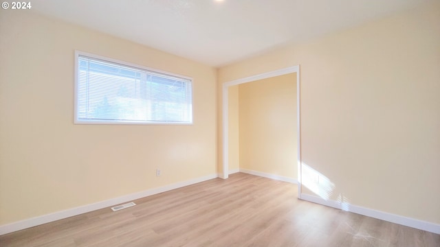 unfurnished room featuring light hardwood / wood-style flooring