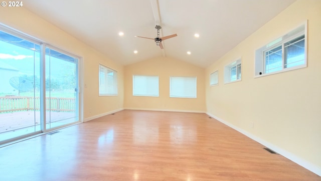 empty room featuring light hardwood / wood-style flooring, ceiling fan, and lofted ceiling