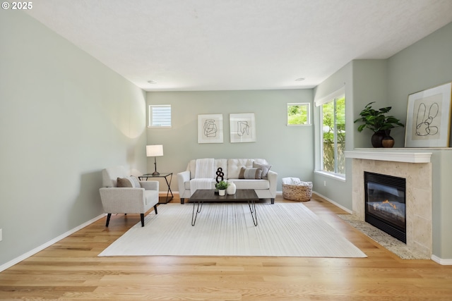3501 SE 171st Ave, Vancouver, WA 98683 - living area featuring healthy amount of natural light, wood finished floors, and a high end fireplace