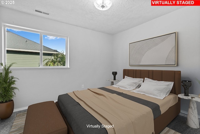 bedroom featuring a textured ceiling