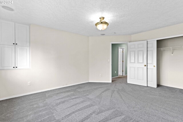 3501 SE 171st Ave, Vancouver, WA 98683 - unfurnished bedroom featuring carpet floors, a textured ceiling, and a closet