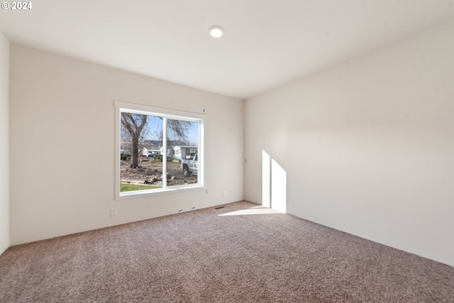 spare room featuring carpet flooring