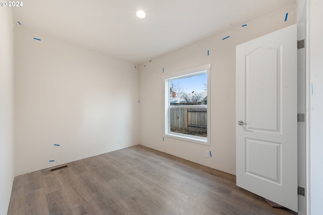 spare room featuring light hardwood / wood-style flooring