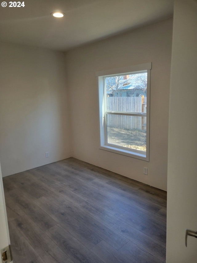 empty room with dark hardwood / wood-style floors