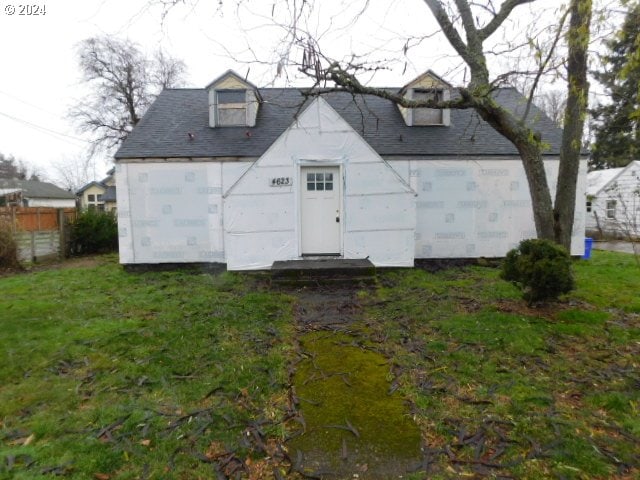 view of outbuilding featuring a lawn