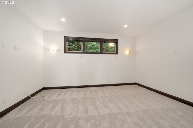 unfurnished room with light carpet