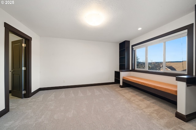 carpeted bedroom with a textured ceiling