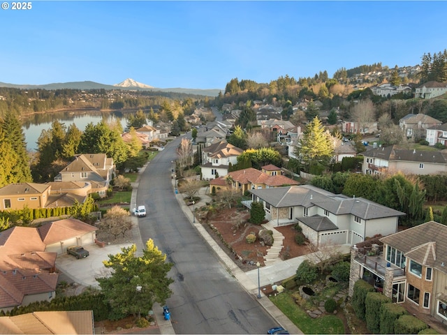 bird's eye view featuring a water and mountain view