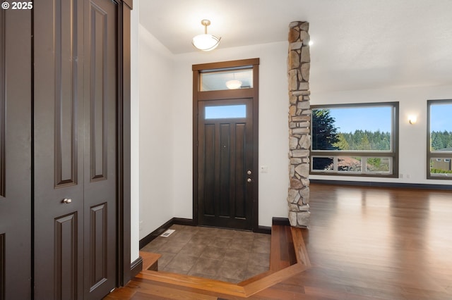 foyer with dark wood-type flooring