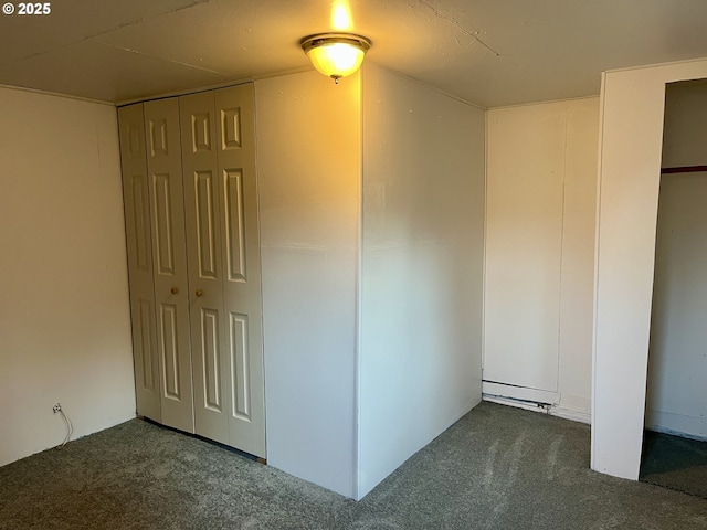 empty room with dark colored carpet