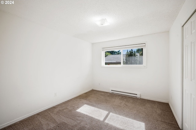 unfurnished bedroom with a closet, a baseboard radiator, carpet flooring, and a textured ceiling