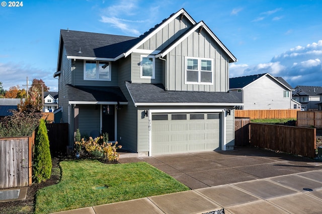 view of front of house with a front lawn and a garage