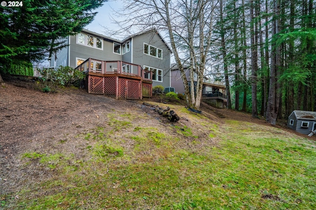 rear view of house with a wooden deck