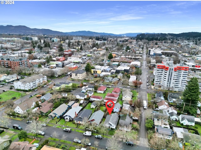aerial view featuring a view of city and a mountain view