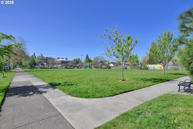 view of property's community with a yard