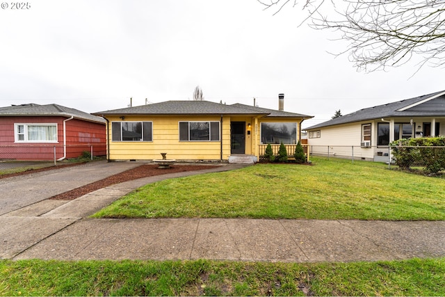 single story home with a front yard