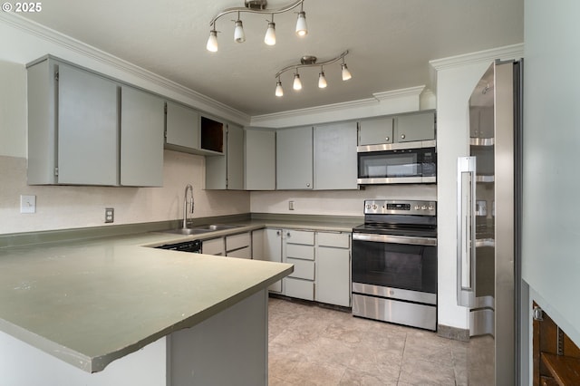 kitchen with gray cabinetry, crown molding, sink, kitchen peninsula, and stainless steel appliances